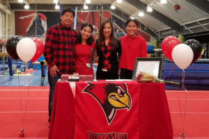 (Contributed photo courtesy of Kaylee Sugimoto) Camas High School senior Kaylee Sugimoto (second from left) celebrates with her father, Glen (far left), mother Marnie (second from right) and sister Mia (far right) during a signing event at the Multnomah Athletic Club in Portland. Sugimoto signed a letter of intent to continue her gymnastics career at Illinois State University. 