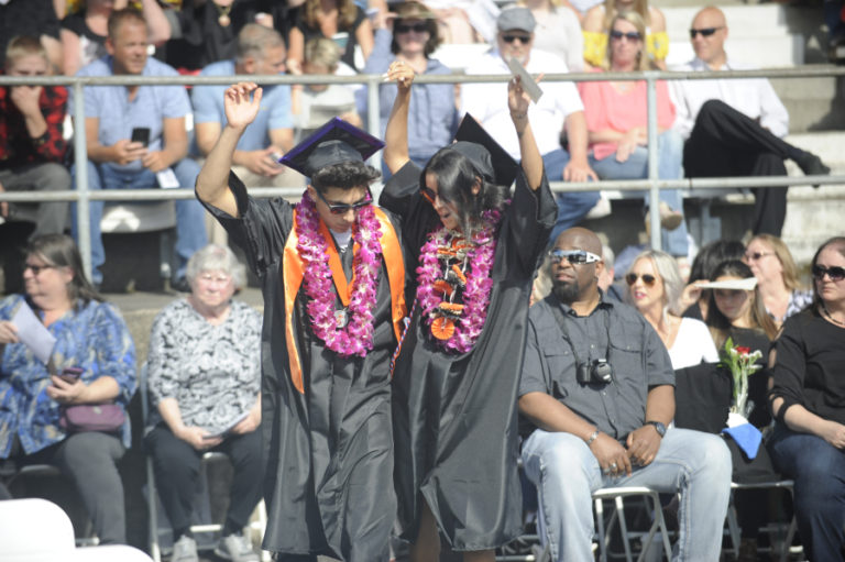Washougal High Class of 2019 graduates get playful during their graduation ceremony in June 2019. Washougal High School plans to hold an in-person graduation ceremony for the Class of 2020 graduates on Aug. 8.