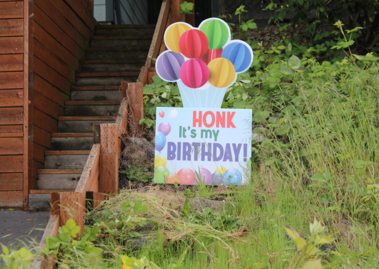 A "Honk, it's my birthday" sign sits outside the Hergenroether home in Camas on Sunday, May 3.
