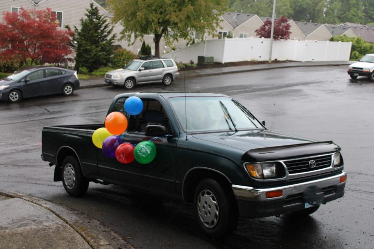 Vehicles drive by the Hergenroether home to celebrate Timothy Hergenroether's eighth birthday on Sunday, May 3.