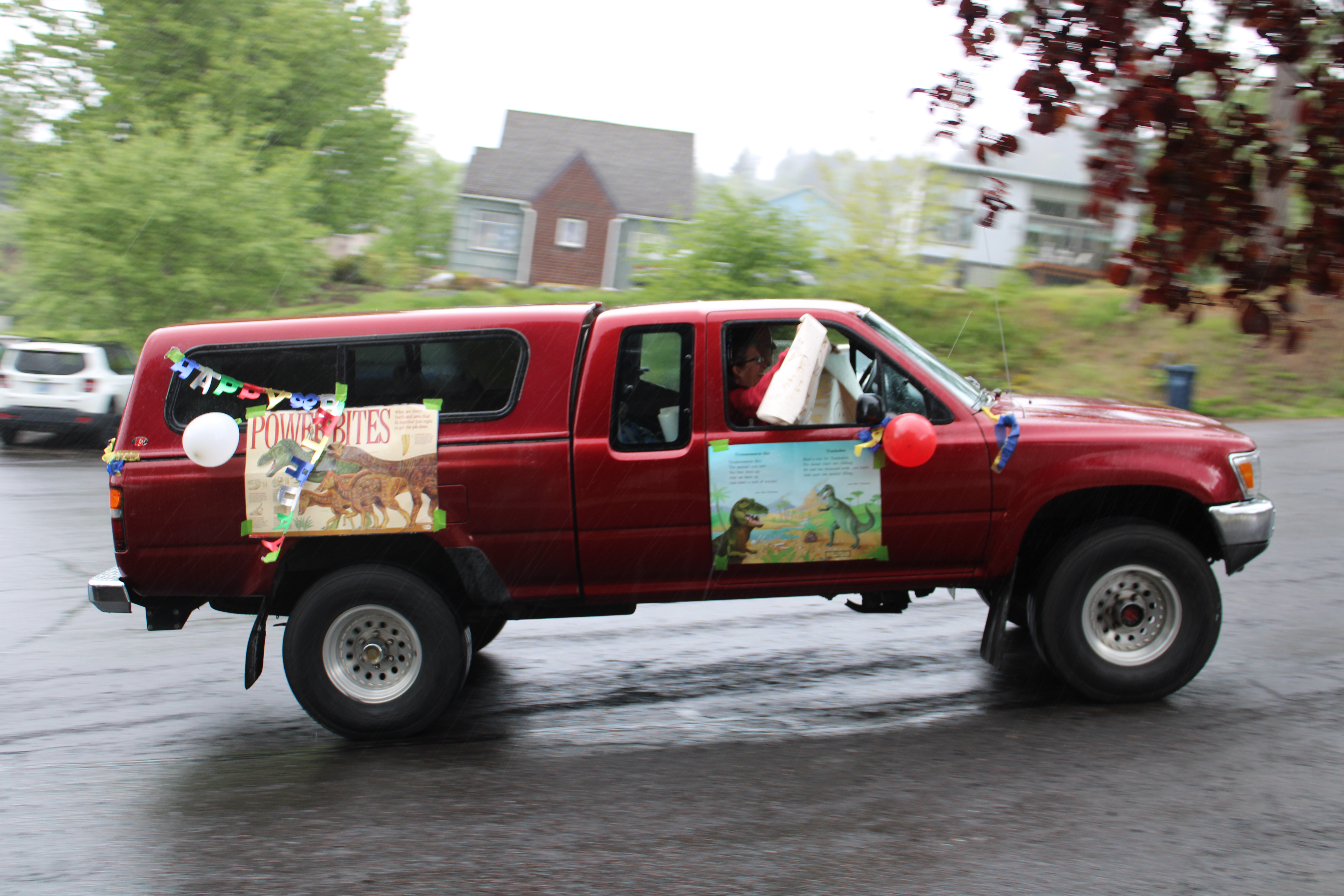 Vehicles drive by the Hergenroether home to celebrate Timothy Hergenroether's eighth birthday on Sunday, May 3.