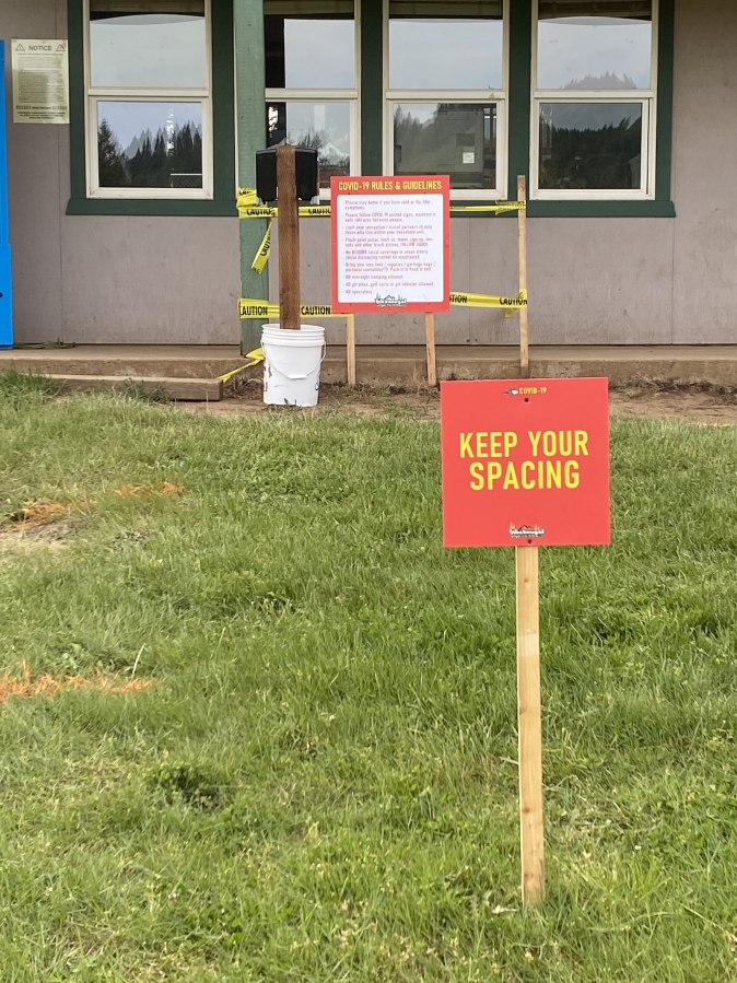 Signs at Washougal MX Park point out new rules meant to slow the spread of COVID-19.