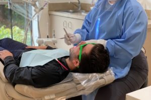 Cori Pacanins, wearing a face mask and "sneeze shield," treats a patient at Washougal Family Dental on Tuesday, June 9. (Contributed photo courtesy of Tarra Cochell, Washougal Family Dental)