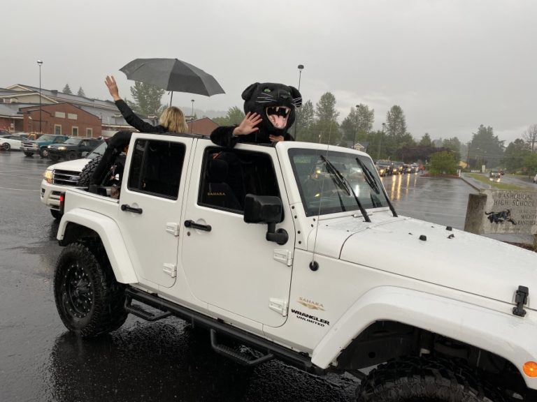 Washougal High School seniors celebrate while driving down Main Street in downtown Washougal on Friday, June 5, as part of the school&#039;s &quot;Senior Car Parade and Sunset Viewing&quot; event, which preceded a virtual graduation ceremony the next day.