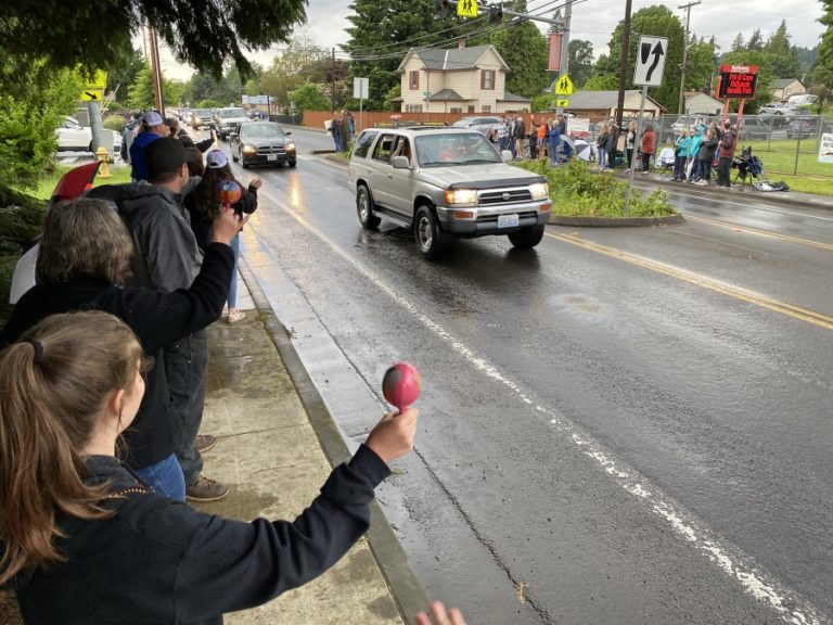 Contributed photo by Rene Carroll, courtesy of Washougal School District
Friends, family members and other community residents gather on Main Street in downtown Washougal to congratulate Washougal High School seniors on Friday. June 5, during the school&#039;s &quot;Senior Car Parade and Sunset Viewing&quot; event, which preceded a virtual graduation ceremony the next day.