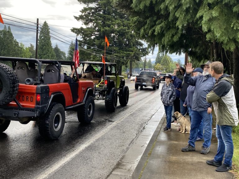 Friends, family members and other community residents gather on Main Street in downtown Washougal to congratulate Washougal High School seniors on Friday. June 5, during the school&#039;s &quot;Senior Car Parade and Sunset Viewing&quot; event, which preceded a virtual graduation ceremony the next day.