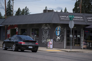 A motorist drives past Limitless America, a gun store in Washougal on June 11. (Amanda Cowan/The Columbian)