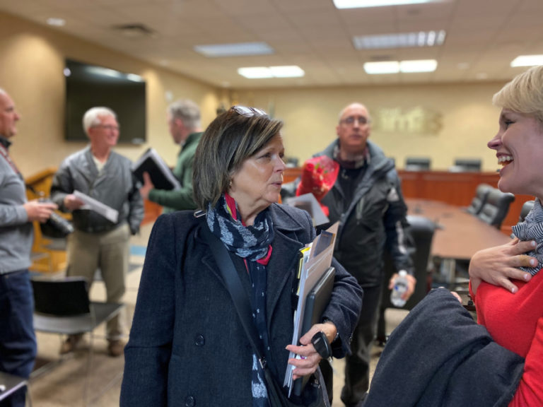 Camas City Councilwoman Shannon Roberts (center) leaves a December 2019 council meeting. Roberts recently said she is concerned about health impacts of wearing masks in the fight against COVID-19, and showed support for former state legislator Liz Pike's recent stance against Washington Governor Jay Inslee's statewide mask mandate. In a Facebook post that has garnered more than 400 "likes," Pike said she would not wear a mask and would not give her money to businesses that made her wear one. Under Inslee's order, the majority of people are required to wear face coverings when inside public spaces such as retail shops, churches and lobbies, as well as outdoors where social distancing of six feet cannot be maintained.