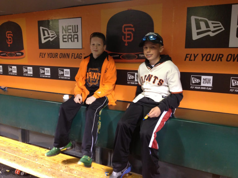 Camas resident Tyler Forner (left) sits in a dugout at AT&amp;T Park in San Francisco. Forner signed with the Giants last month.