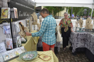Visitors to the 2019 Washougal Arts Festival browse artist booths. The 2020 art festival will be held online throughout the month of August due to the ongoing COVID-19 pandemic. (Contributed photos courtesy of Washougal Arts and Culture Alliance)