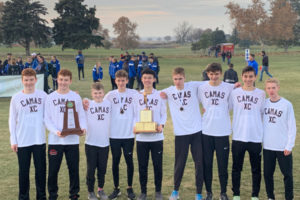 Members of the Camas High School boys cross country team hoist the 4A state championship trophy in Pasco, Wash., in November 2019. The 4A Greater St. Helens League cross country season has been delayed until 2021. (Contributed photo courtesy of Matt Legrand)