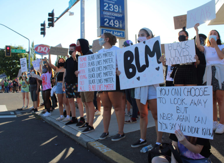 Young people gather, holding signs in support of the Black Lives Matter movement, during a counterprotest to a &quot;Back the Blue&quot; pro-police rally happening in downtown Camas on Friday, Aug.