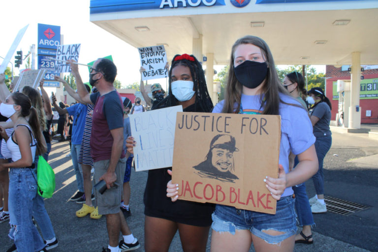 Camas teen ???? (right) and Vancouver teen ???? (left) hold signs in support of the Black Lives Matter movement at a counterprotest held Friday, Aug.