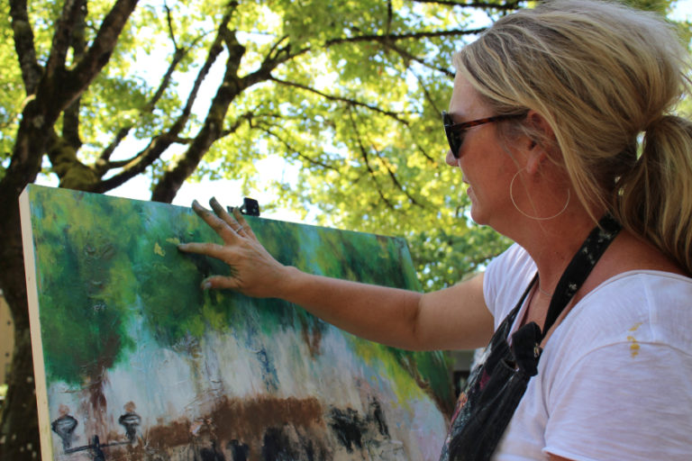 Camas artist Heidi Jo Curley paints a downtown Camas scene at the 2018 "Plein Air" art event in downtown Camas.
