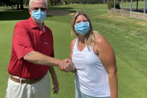 Washougal resident Melissa Joyal (right) shakes hands with Orchard Hills Country Club professional Kevin Coombs after winning the club's women's division championship on Aug. 2. (Contributed photo courtesy of Melissa Joyal)