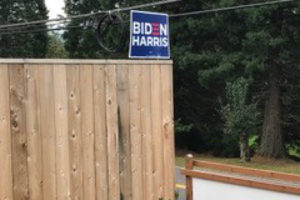 A Biden-Harris sign sits outside a Washougal home in September. The couple who lives in the home says they have been harassed over the campaign sign, with people shooting their home with paintballs, vandalizing their signs and sending a hostile letter. (Contributed photo)
