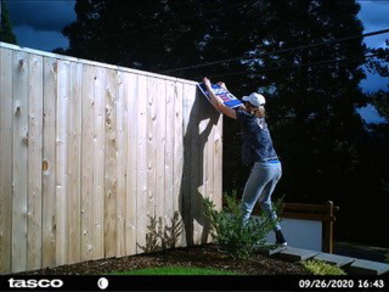A Washougal couple's outside camera captured this image of a person trying to tear down the couple's Biden-Harris campaign sign on Sept. 26. Washougal police have been unable to identify the suspect in the photos.