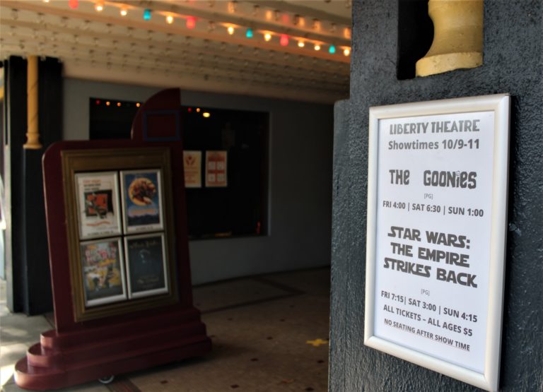 A sign outside the Liberty Theatre in downtown Camas on Friday, Oct. 9, advertises "The Goonies" and "Star Wars: The Empire Strikes Back," the first movies to be shown inside the historic theater since the start of the COVID-19 pandemic in mid-March.