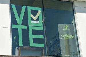 A "VOTE" sign hangs from the second-story window of Reed Creative in Washougal. The marketing firm is participating in the American Institute of Graphic Arts' "Get Out The Vote" campaign this fall. (Contributed photo courtesy Lori Reed)
