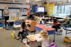 Kindergarten teacher Marilyn Canfield leads students at Helen Baller Elementary School in Camas on Monday, Nov. 9, the first day of in-person kindergarten classes at the school district since the COVID-19 pandemic shuttered classrooms throughout Clark County in March 2020. (Contributed photo by Doreen McKercher, courtesy of the Camas School District)