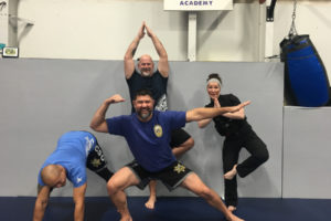 First responders, including Chris Pizan, Brentt Blair, Chris de la Rocha and Washougal police officer Ashley Goulding (right) take a tactical yoga class at Forge Combat Academy in Camas on Nov. 9. (Contributed photos courtesy of Sheila Schmid)