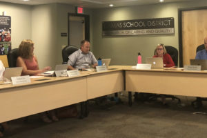 Camas School Board members (from left to right) Erika Cox, Tracey Malone, Corey McEnry, Connie Hennessey and Doug Quinn discuss district business at a meeting on Aug. 25, 2019. (Kelly Moyer/Post-Record)