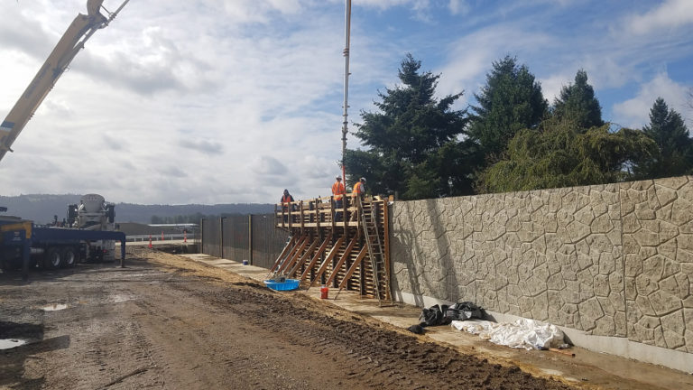 Construction crews construct a floodwall near the Steigerwald Lake National Wildlife Refuge in 2020, as part of the Steigerwald Connection Project.