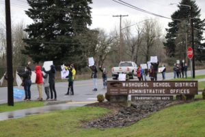 A group protests school closures due to the COVID-19 pandemic in front of the Washougal School District headquarters on Dec. 17, 2020. (Doug Flanagan/Post-Record)