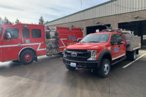 A new squad vehicle (right) is parked next to a larger, more traditional fire engine outside of East County Fire and Rescue's Station 91 in Fern Prairie on Thursday, Jan. 7, 2021. (Contributed photo courtesy of East County Fire and Rescue)