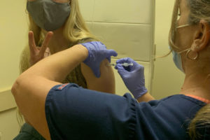 Camas-Washougal Fire Department Fire Captain Katie Linton receives her second COVID-19 vaccination on Jan. 12, 2021. (Contributed photo courtesy of the East Clark Professional Fire Fighters union)