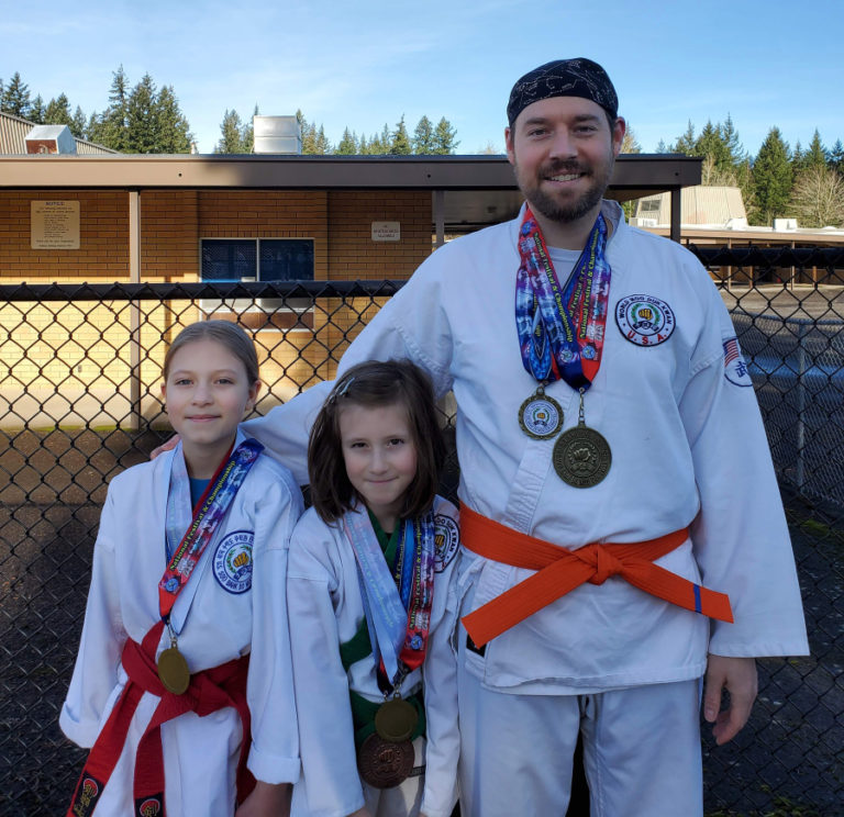Camas Soo Bahk Do students (from left to right) Arabella Siler, Serena Siler and Matthew Siler display their medals from the 2020 Soo Bahk Do Moo Duk Kwan Federation National Festival.