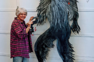 Contributed photo courtesy of Shirley Patterson-Wallace 
 Washougal resident Shirley Patterson-Wallace paints 'The Beast,' an 8-foot-tall representation of the werewolf from her latest novel, "Mr. Grayson." (Doug Flanagan/Post-Record)