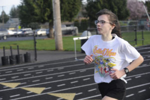 Washougal  runner Sidney Boothby works on her form during a practice session in March 2020. Boothby is one of the top returning runners for the Panthers' girls cross country team, which begins its 2020 season this week. (Post-Record file photos)