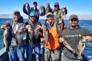Contributed photo courtesy of Amy McNealy 
 A group of military veterans display their catches during a fishing trip put on by The Fallen Outdoors, a nonprofit organization that facilitates hunting and fishing trips for veterans.
