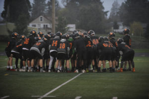 Washougal High School football players huddle before a game in November 2019. 2A Greater St. Helens League football teams began playing again this week after the county moved to Phase 2 of the state's COVID-19 reopening plan. (Post-Record file photo)