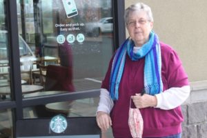 Pam Clark stands in front of Washougal's Starbucks store on Feb. 10, 2021. Clark, a Washougal resident, led a volunteer effort to deliver unsold food from the store to local people in need until earlier this year, when the Starbucks Corporation directed the store's unsold food items be delivered to Feeding America, the United States' largest hunger relief organization, through its FoodShare program. (Doug Flanagan/Post-Record)