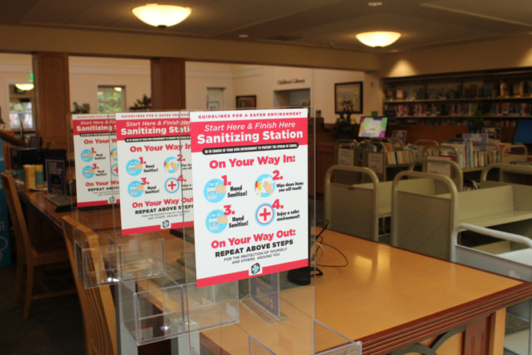 Sanitizing stations sit inside the Camas Public Library on Friday, March 5, 2021. Library staff are preparing to reopen limited indoor services on March 15, 2021, after a nearly yearlong closure due to the COVID-19 pandemic.