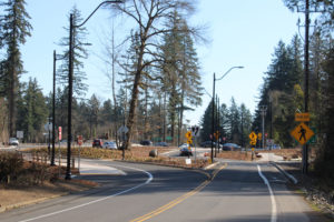 Traffic moves through the newly completed roundabout at Everett Street and Lake Road in Camas on Friday, March 19, 2021. (Kelly Moyer/Post-Record)