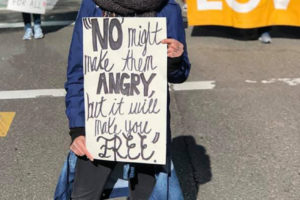 Washougal High School teacher Charlotte Lartey holds a "'No' might make them angry, but it will make you free" sign at a Black Lives Matter march march in 2020. (Contributed photo courtesy of Charlotte Lartey)