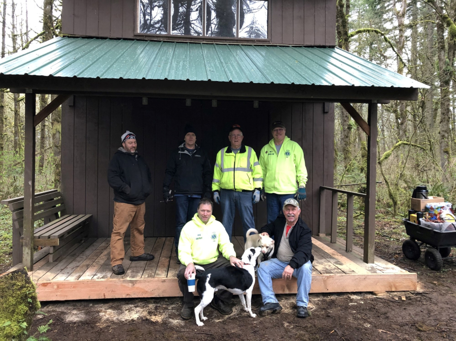 Camas Lions repair winddamaged adirondack at Camp Currie Camas