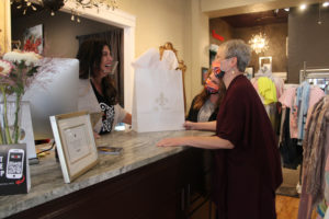 Downtown Camas Association Executive Director Carrie Schulstad (right) and DCA Event and Volunteer Coordinator Jan Carter (center) talk to Lily Atelier owner Marilyn Reed (left) at the downtown Camas boutique on Friday, March 19, 2021. (Kelly Moyer/Post-Record)