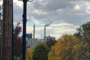The view west from Northeast Fifth Avenue in downtown Camas shows Georgia-Pacific paper mill chimneys billowing white steam in 2017. (Post-Record file photo)