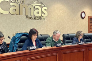 Camas City Council members Ellen Burton (left), Melissa Smith (second from left) and Shannon Roberts (right) listen to citizen comments with Camas Mayor Barry McDonnell (second from right) at a December 2019 city council meeting. (Kelly Moyer/Post-Record file photo)
