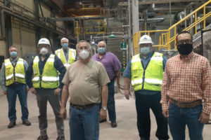 Team members attend a ribbon cutting for a new boiler system at the Georgia-Pacific paper mill in downtown Camas. Pictured from left to right are: Monty Akin, Erik Mattson, Pat Terry, Jim Ingenthron, Jon Busby, Shawn Wood and Lawrence Sylvester. (Contributed photo courtesy of Georgia-Pacific) 