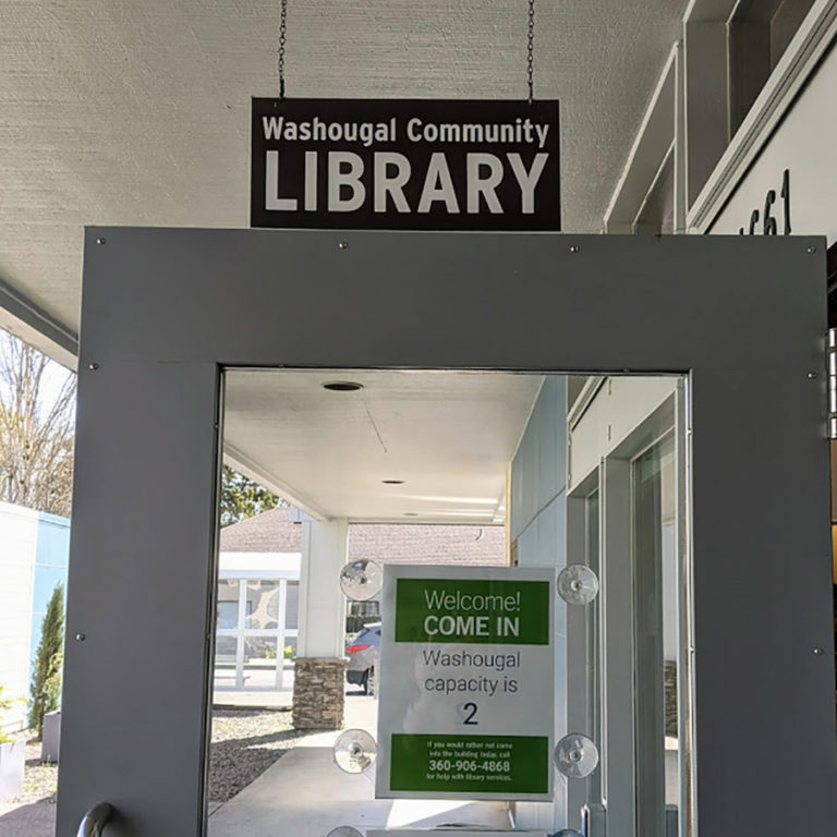 Contributed photo courtesy Rachael Ries 
 A sign on the front door of the Washougal Community Library informs patrons of the facility&#039;s limited capacity. The library reopened on Monday, April 20, after being closed since March 2020 due to the COVID-19 pandemic.