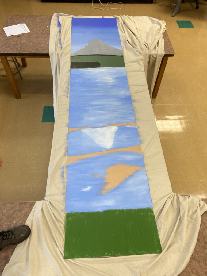 The painting that will be erected onto the metal post in the parking lot of the Washougal Food Center includes representations of the Columbia River and Mount Hood.