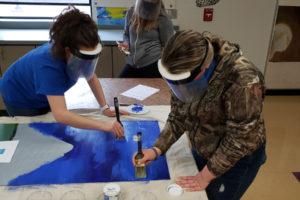 Washougal students work on a painting at Washougal High School in April 2021. The project is part of the Unite! Washougal community coalition's latest beautification project. (Contributed photo courtesy of Dani Allen)