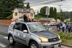 Community members celebrate Washougal High seniors during a senior car parade on Main Street in downtown Washougal on June 5, 2020. The school district debuted the senior parade in 2020 after it was forced to cancel its traditional, in-person graduation ceremony due to the COVID-19 pandemic. The parade was so successful, the Washougal School District has decided to make it an annual tradition. (Contributed photo by Rene Carroll, courtesy of Washougal School District)