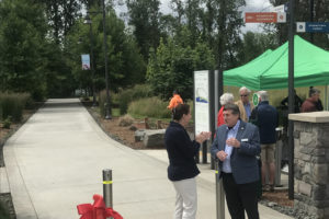 Sen. Ann Rivers, left, talks with Port of Camas-Washougal Commissioner Larry Keister at a ribbon-cutting ceremony to mark the completion of the Columbia River Connector Trail on Monday, June 7, 2021. (Doug Flanagan/Post-Record)