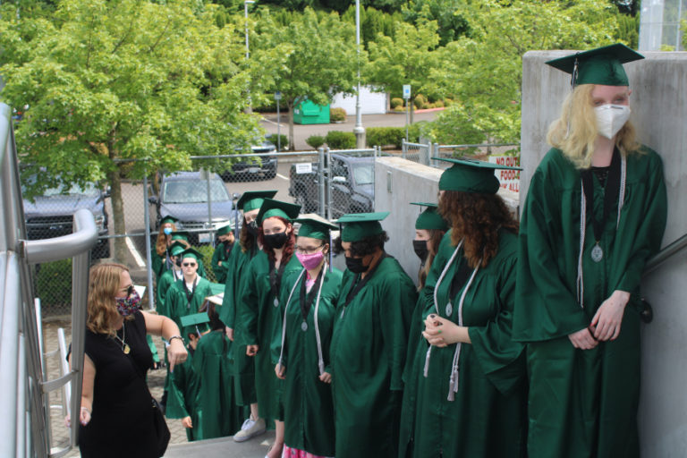 Hayes Freedom High School seniors from the class of 2021 wear face masks to prevent the spread of COVID-19 and prepare to walk out to their high school graduation ceremony, held Saturday, June 12, 2021, at Doc Harris Stadium in Camas.